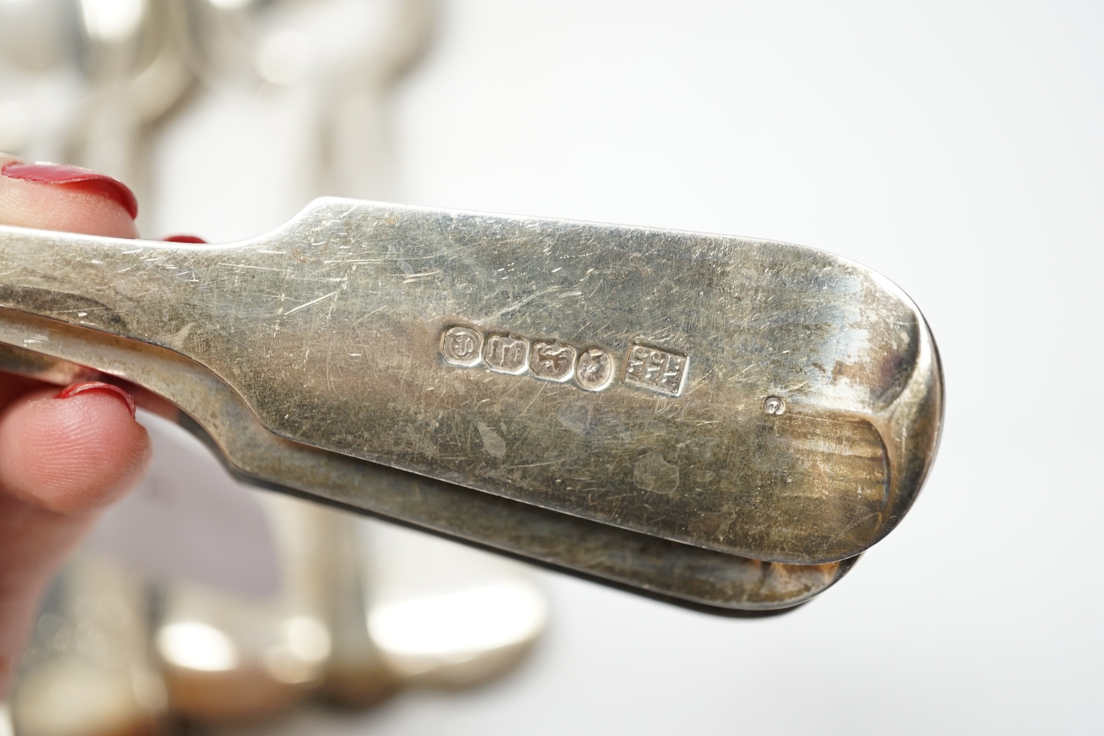 A set of twelve Victorian provincial silver fiddle pattern tablespoons, by Robert Williams & Sons, Exeter, 1852, 22.8cm, 30.4oz. Condition - fair